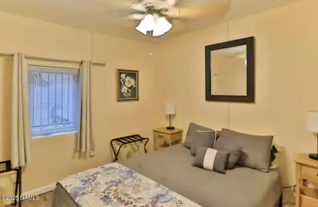 a bedroom with bed and window