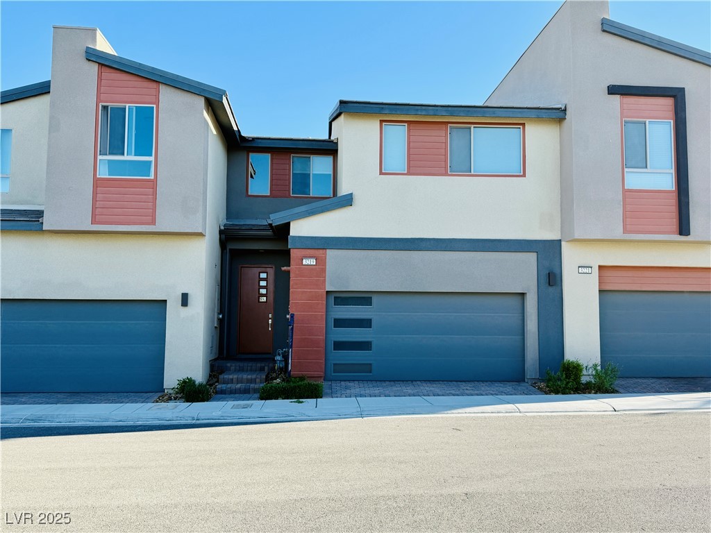 3219 Timorasso Avenue Henderson, NV 89044 - Photo 1 of 27 Contemporary house with stucco siding and a garage