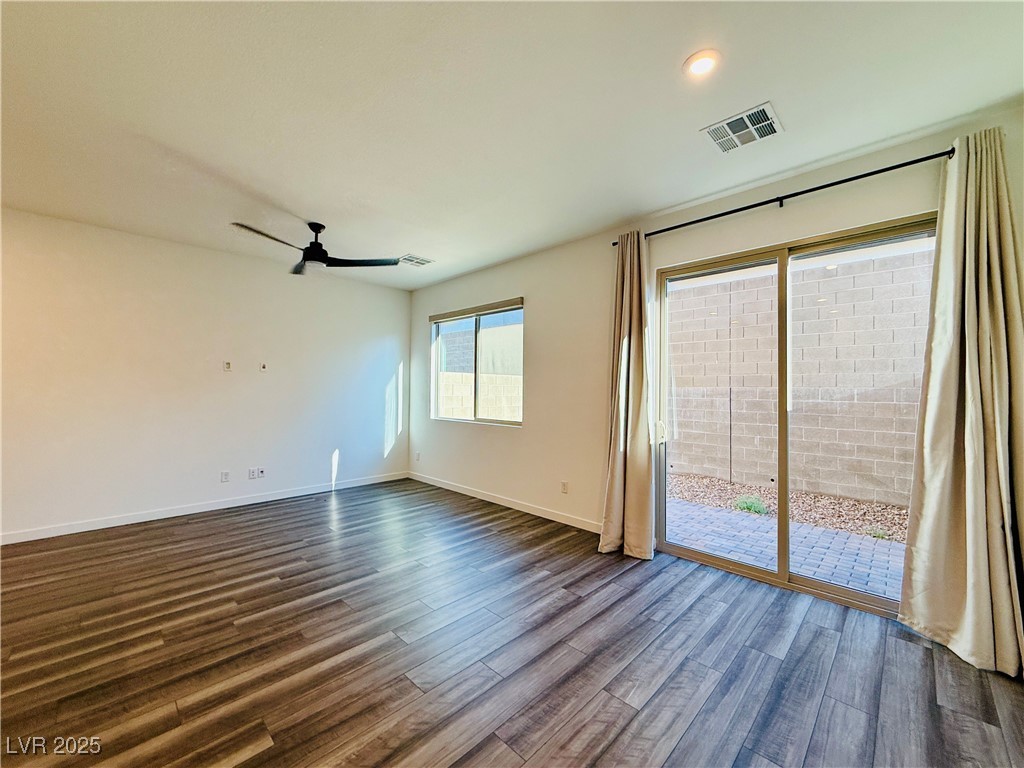 3219 Timorasso Avenue Henderson, NV 89044 - Photo 11 of 27 Spare room featuring dark wood-style floors, ceiling fan, and recessed lighting