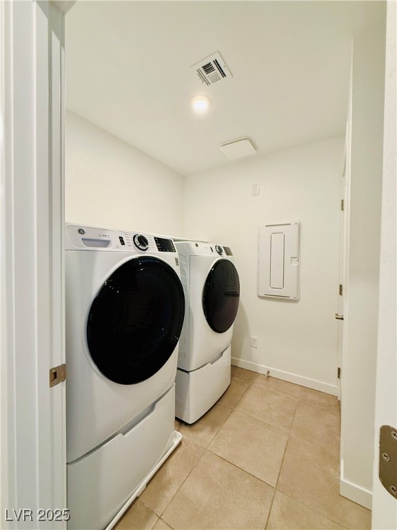 3219 Timorasso Avenue Henderson, NV 89044 - Photo 13 of 27 Laundry room with light tile patterned flooring, washing machine and clothes dryer, and recessed lighting