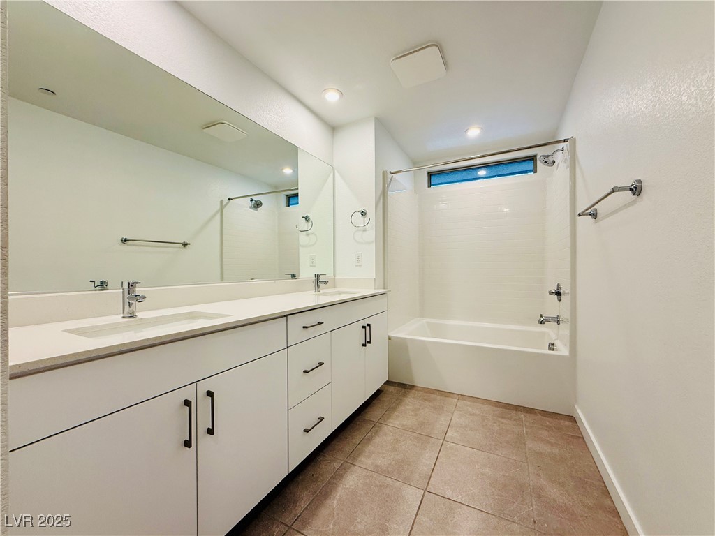 3219 Timorasso Avenue Henderson, NV 89044 - Photo 18 of 27 Bathroom with shower / tub combination, light tile patterned floors, double vanity, and recessed lighting