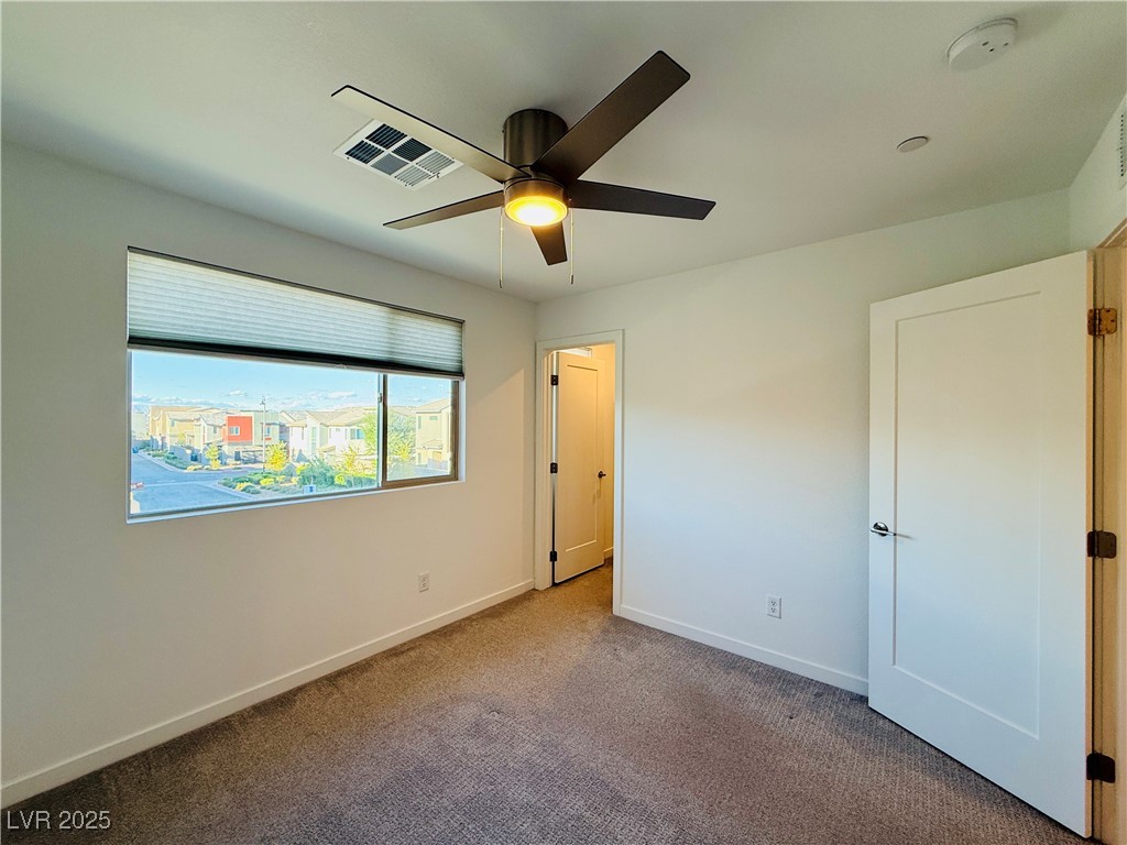 3219 Timorasso Avenue Henderson, NV 89044 - Photo 20 of 27 Unfurnished bedroom with carpet floors and a ceiling fan