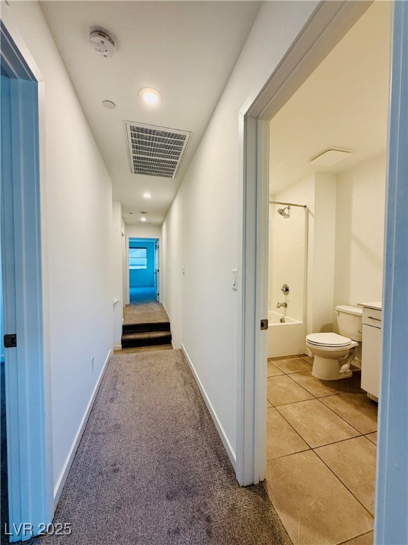 3219 Timorasso Avenue Henderson, NV 89044 - Photo 23 of 27 Hall with light colored carpet, light tile patterned floors, and recessed lighting
