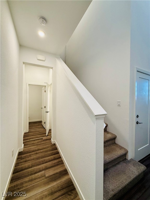 3219 Timorasso Avenue Henderson, NV 89044 - Photo 6 of 27 Stairway featuring wood finished floors and baseboards