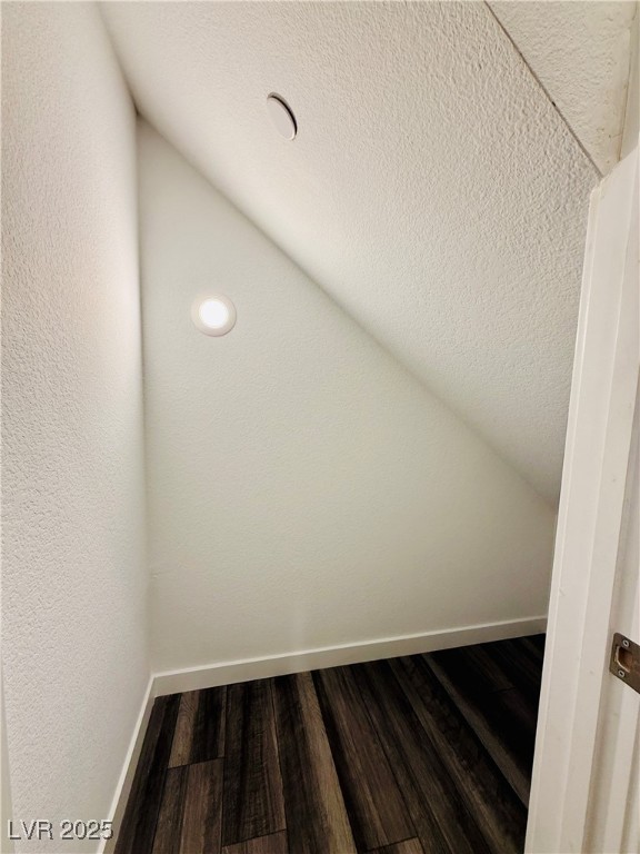 3219 Timorasso Avenue Henderson, NV 89044 - Photo 7 of 27 Additional living space featuring wood finished floors and lofted ceiling