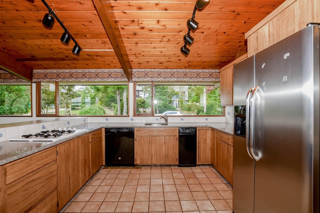15 Arrowhead Lane Marion, MA 02738 - Photo 14 of 42 a kitchen with stainless steel appliances granite countertop a stove a sink dishwasher and a refrigerator