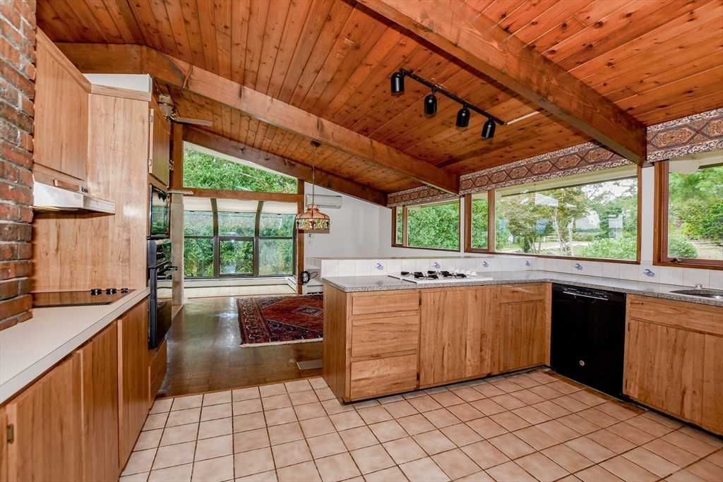 15 Arrowhead Lane Marion, MA 02738 - Photo 15 of 42 a kitchen with stainless steel appliances granite countertop a sink and a counter top space