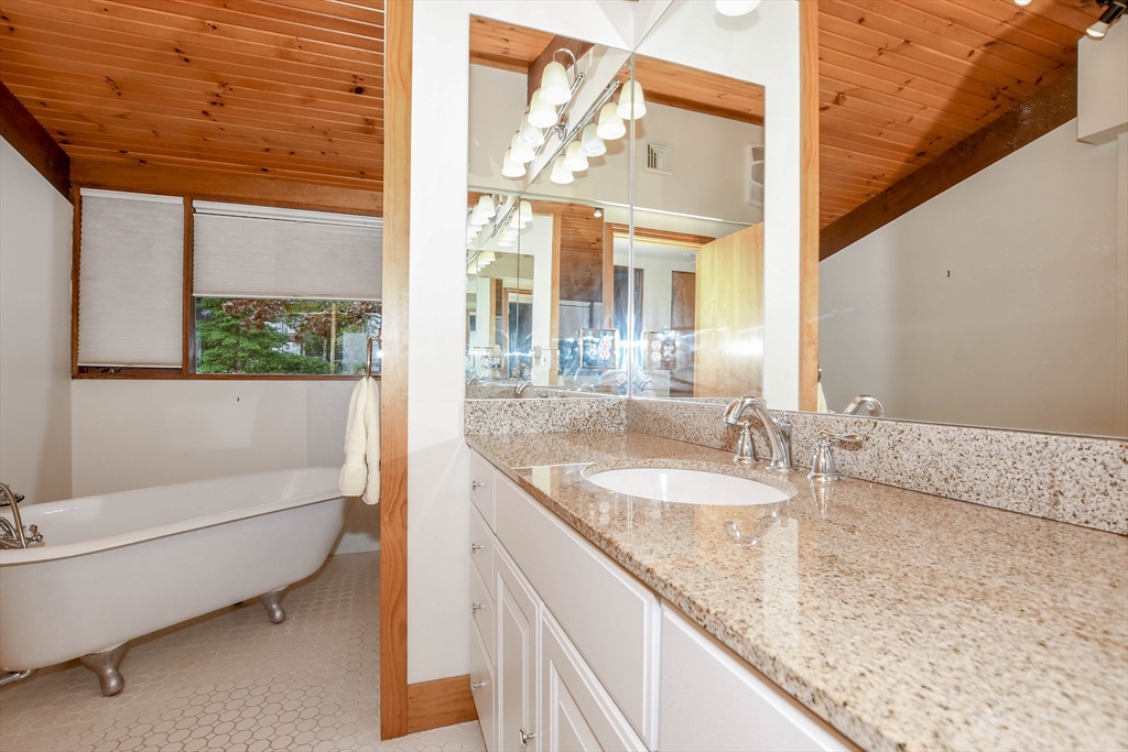 15 Arrowhead Lane Marion, MA 02738 - Photo 26 of 42 a bathroom with a granite countertop sink and a large mirror