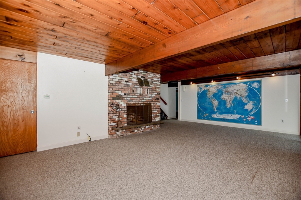 15 Arrowhead Lane Marion, MA 02738 - Photo 30 of 42 a view of an empty room with a fireplace
