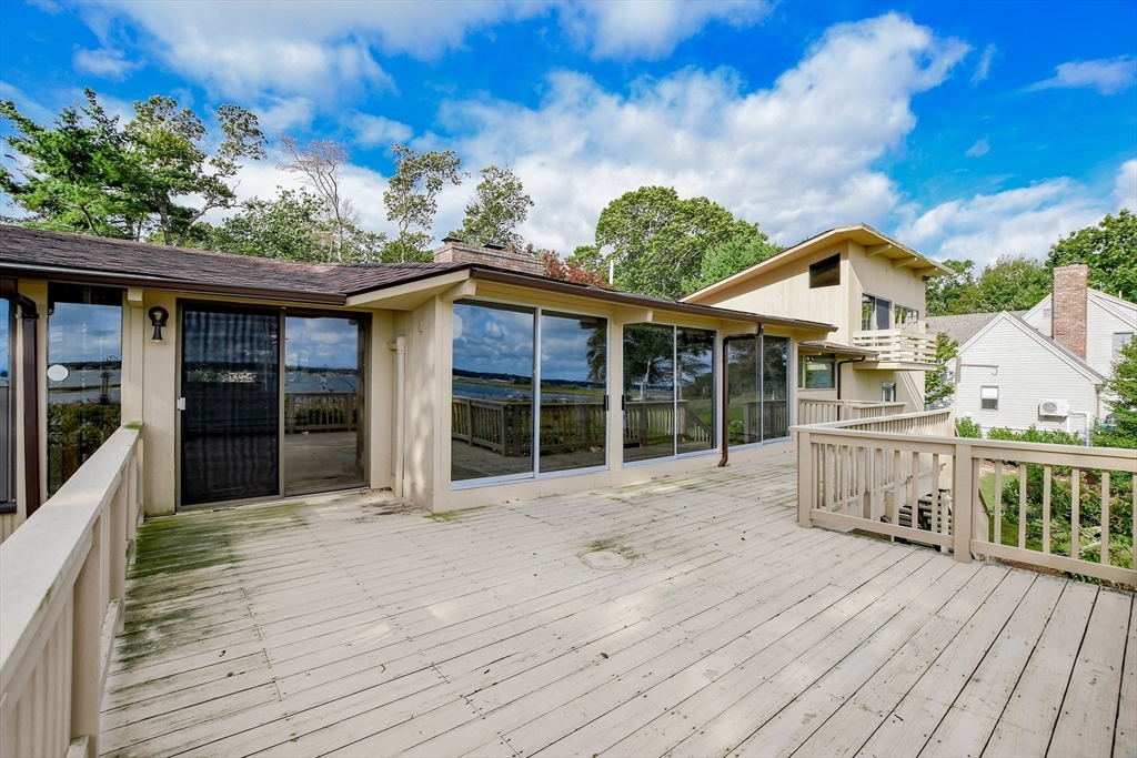 15 Arrowhead Lane Marion, MA 02738 - Photo 33 of 42 a view of house with wooden deck and furniture