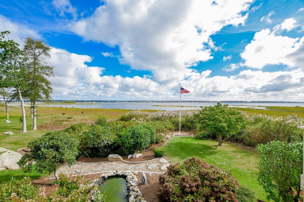 15 Arrowhead Lane Marion, MA 02738 - Photo 4 of 42 a view of a lake with a building in the background