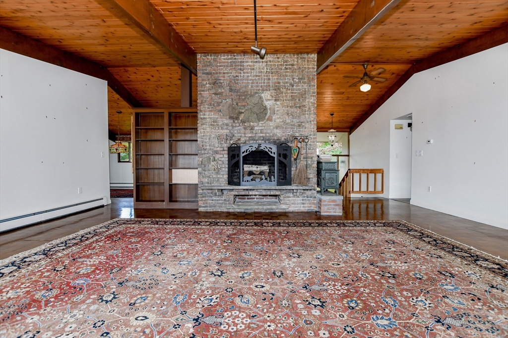 15 Arrowhead Lane Marion, MA 02738 - Photo 6 of 42 a living room with furniture and a fireplace