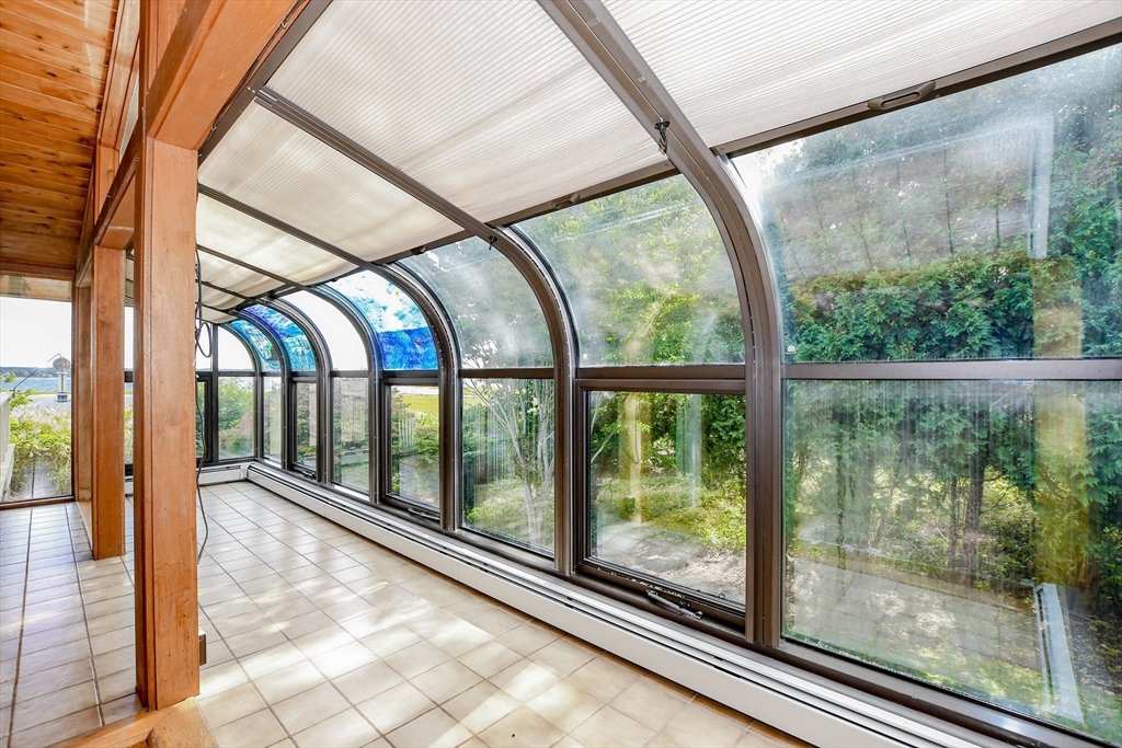 15 Arrowhead Lane Marion, MA 02738 - Photo 8 of 42 a view of a glass door with a outdoor space