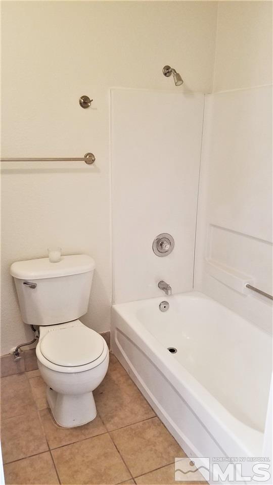 197 East Grove Street, Unit E8 Reno, NV 89502 - Photo 7 of 10 a white toilet sitting next to a bath tub