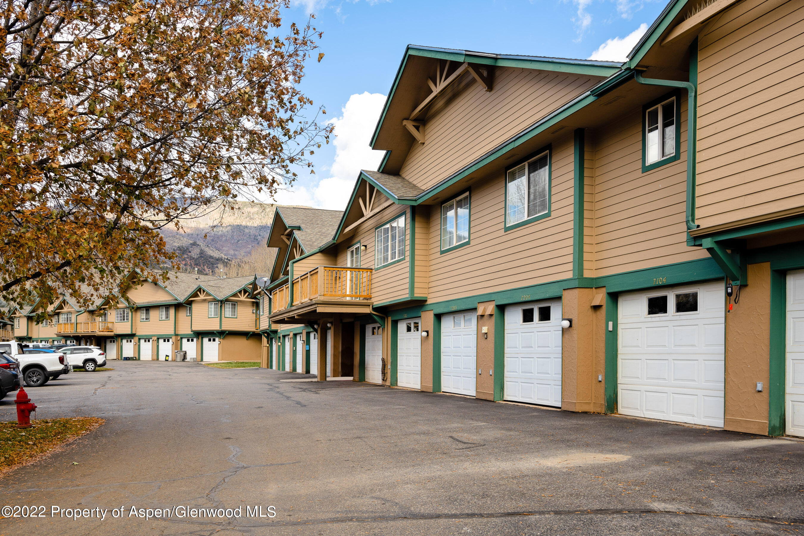 7204 Elk Run Drive Basalt, CO 81621 - Photo 19 of 20 a view of a white house with large windows and a tree