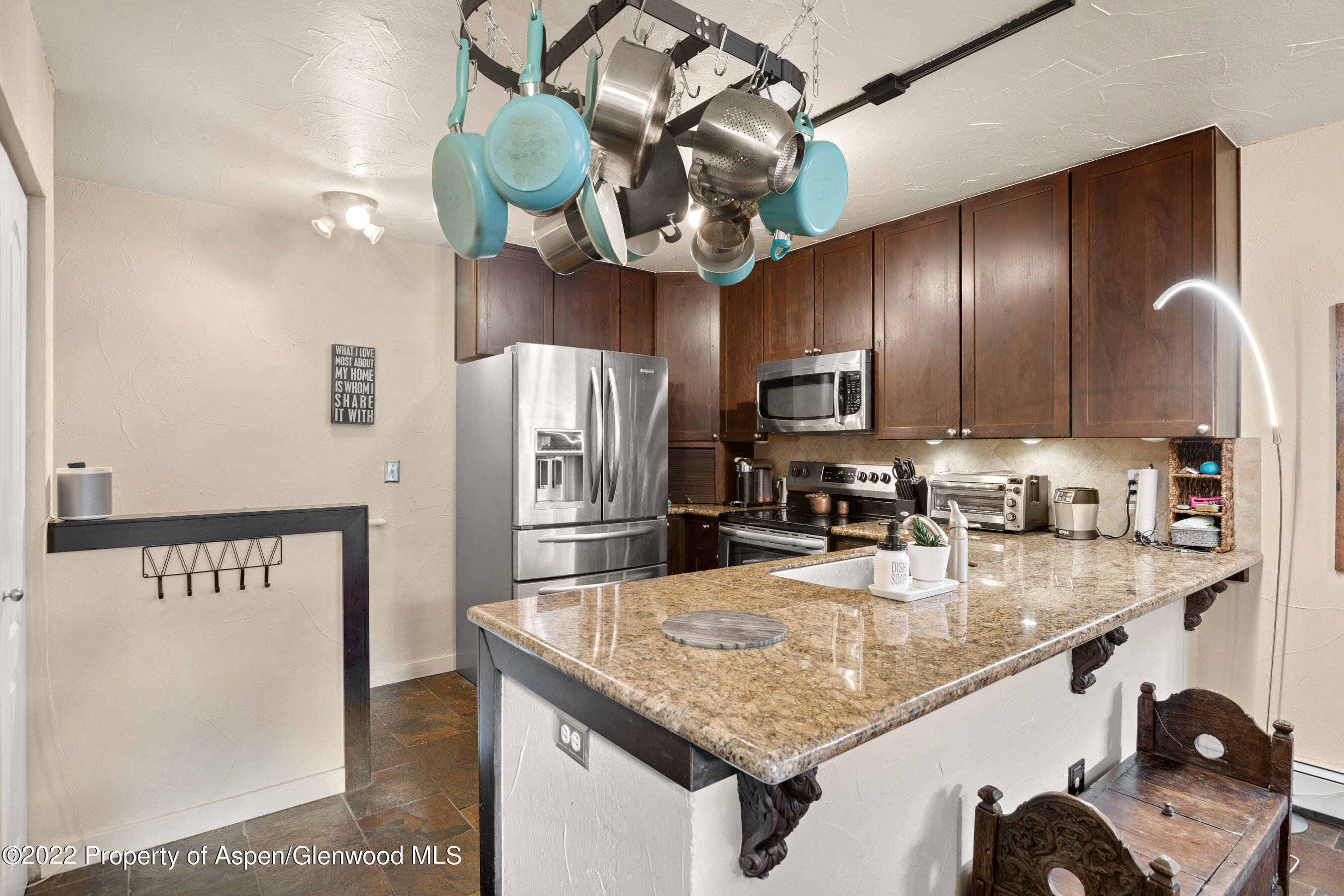 7204 Elk Run Drive Basalt, CO 81621 - Photo 7 of 20 a kitchen with stainless steel appliances granite countertop a sink refrigerator and microwave
