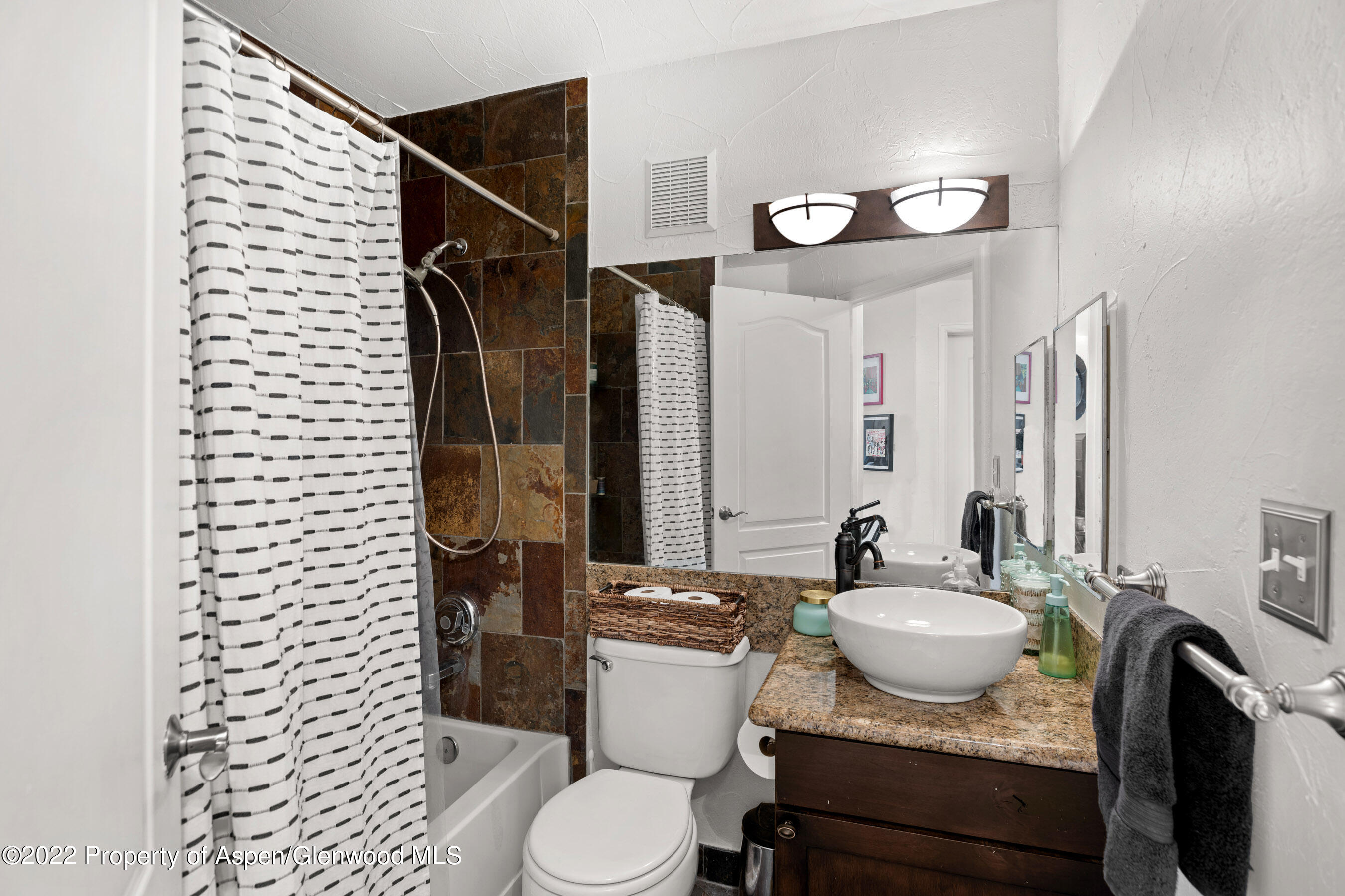 7204 Elk Run Drive Basalt, CO 81621 - Photo 10 of 20 a bathroom with a granite countertop sink and a mirror