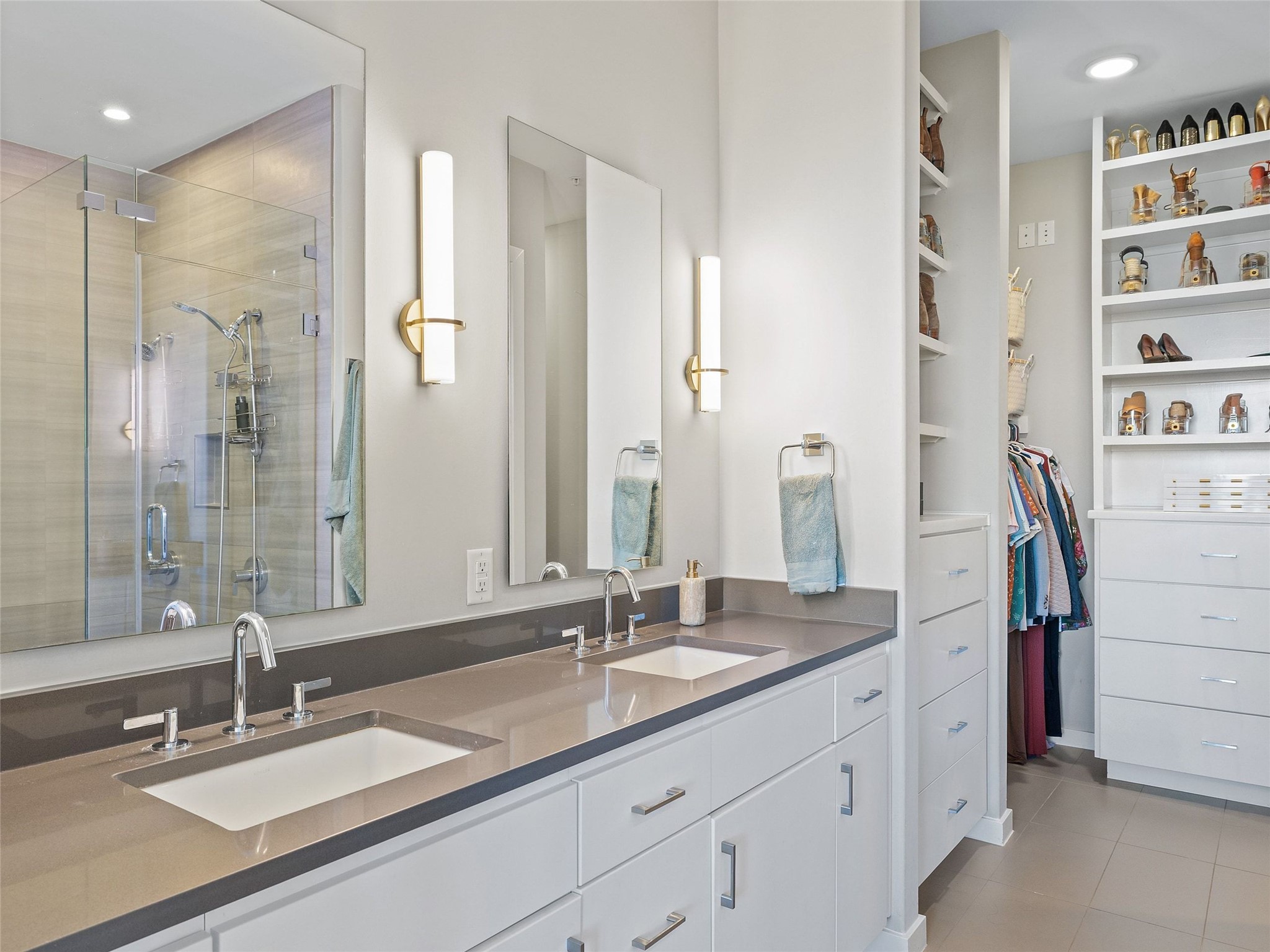 5921 Hiline Road, Unit 1303 Austin, TX 78734 - Photo 19 of 37 a bathroom with a double vanity sink and a mirror