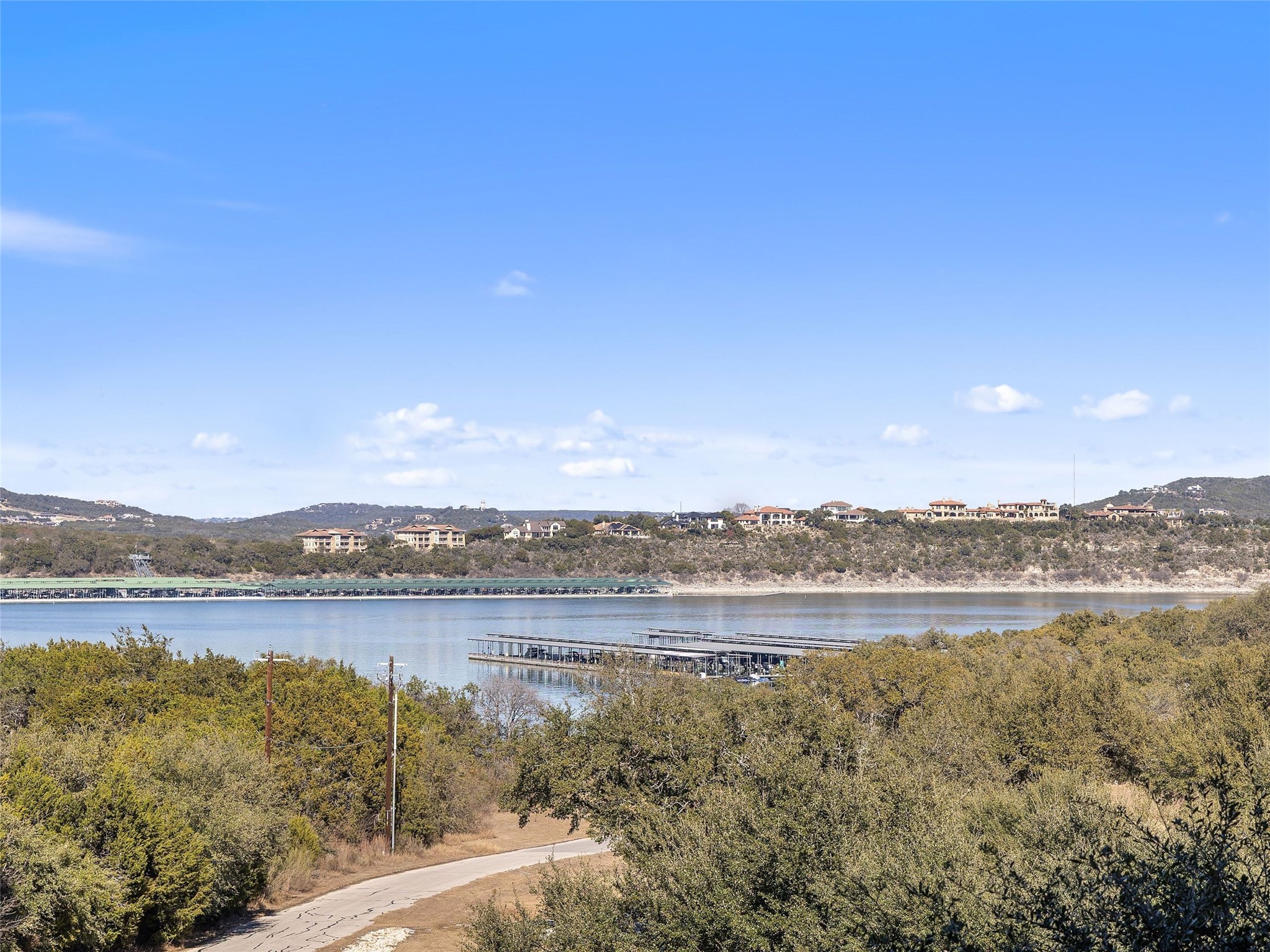 5921 Hiline Road, Unit 1303 Austin, TX 78734 - Photo 2 of 37 a view of an lake and a mountain