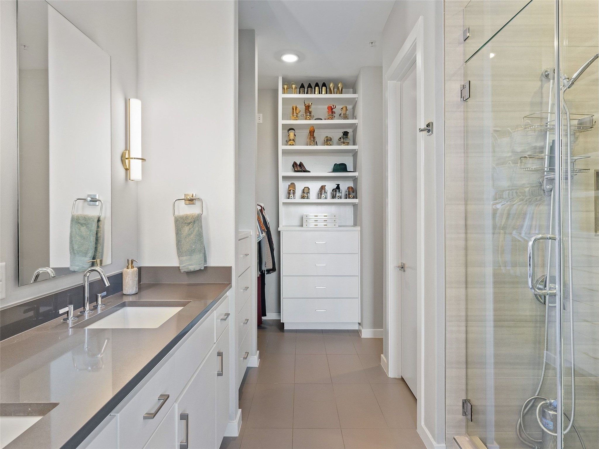 5921 Hiline Road, Unit 1303 Austin, TX 78734 - Photo 20 of 37 a bathroom with a granite countertop sink a shower and a mirror