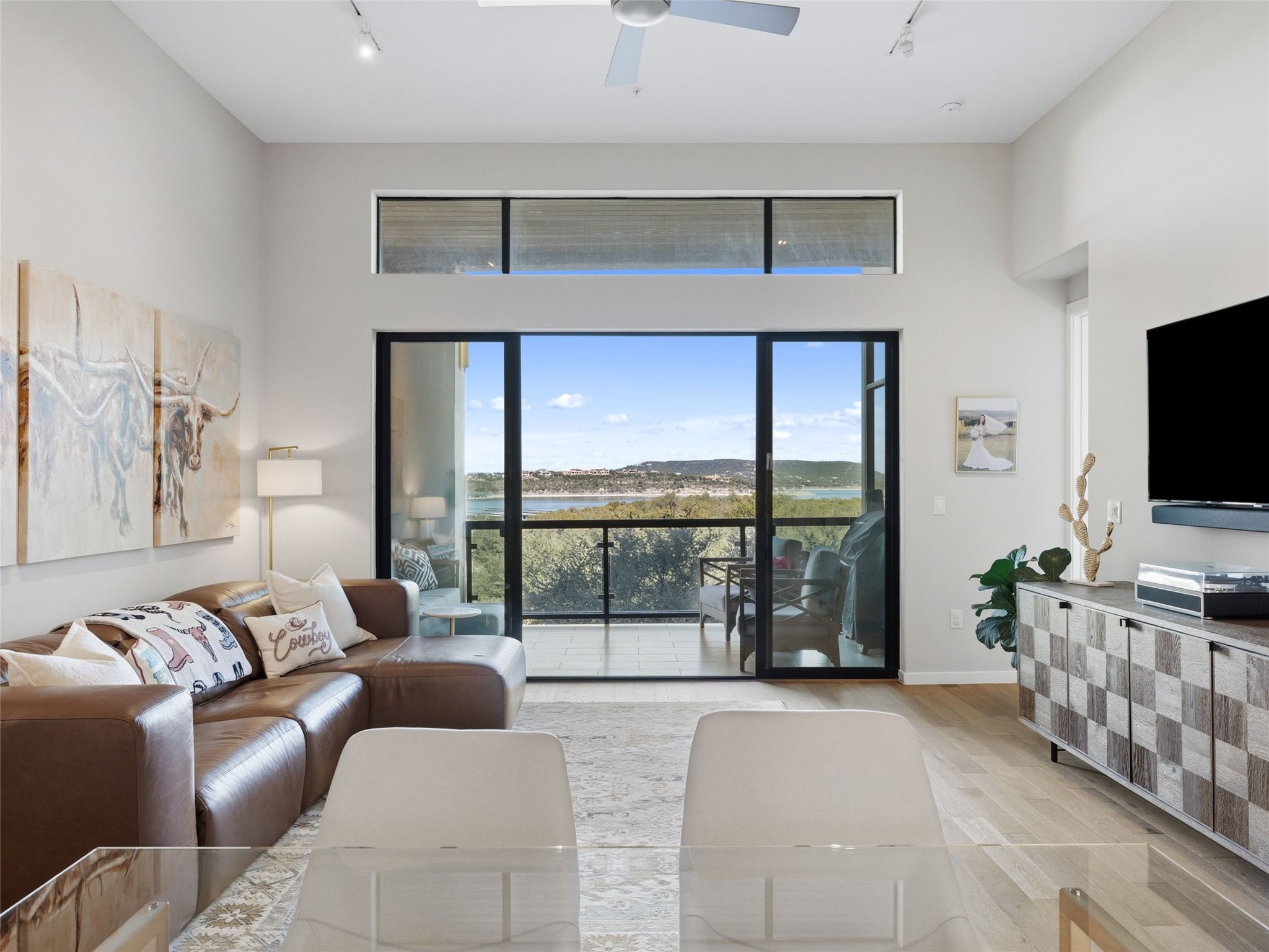 5921 Hiline Road, Unit 1303 Austin, TX 78734 - Photo 3 of 37 a living room with furniture and a flat screen tv