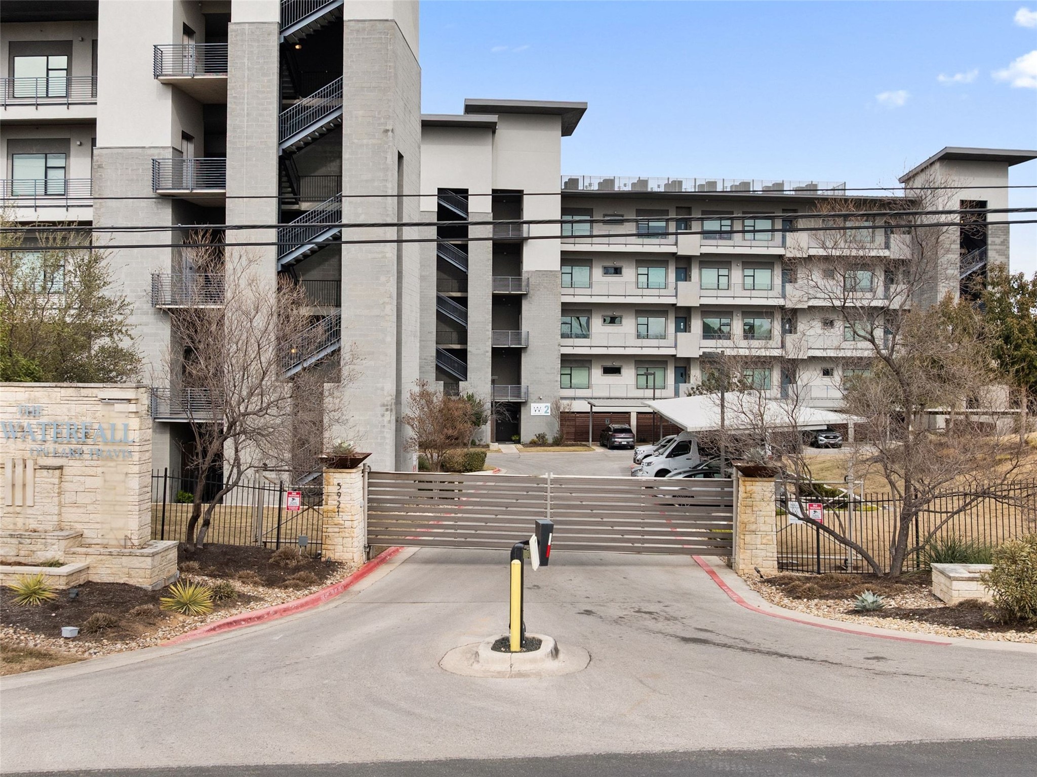 5921 Hiline Road, Unit 1303 Austin, TX 78734 - Photo 30 of 37 a front view of a building with street