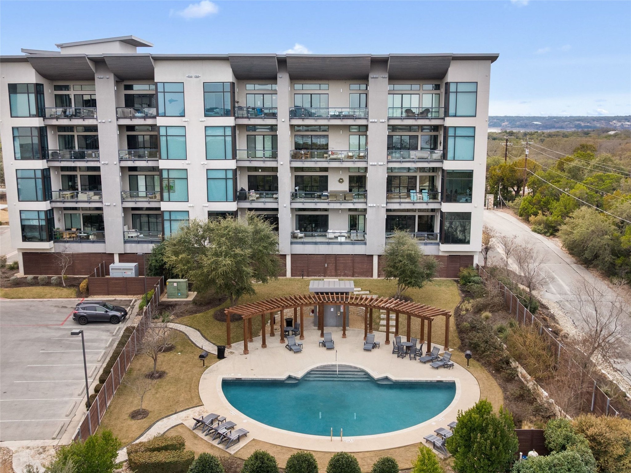 5921 Hiline Road, Unit 1303 Austin, TX 78734 - Photo 31 of 37 a view of a house with a swimming pool