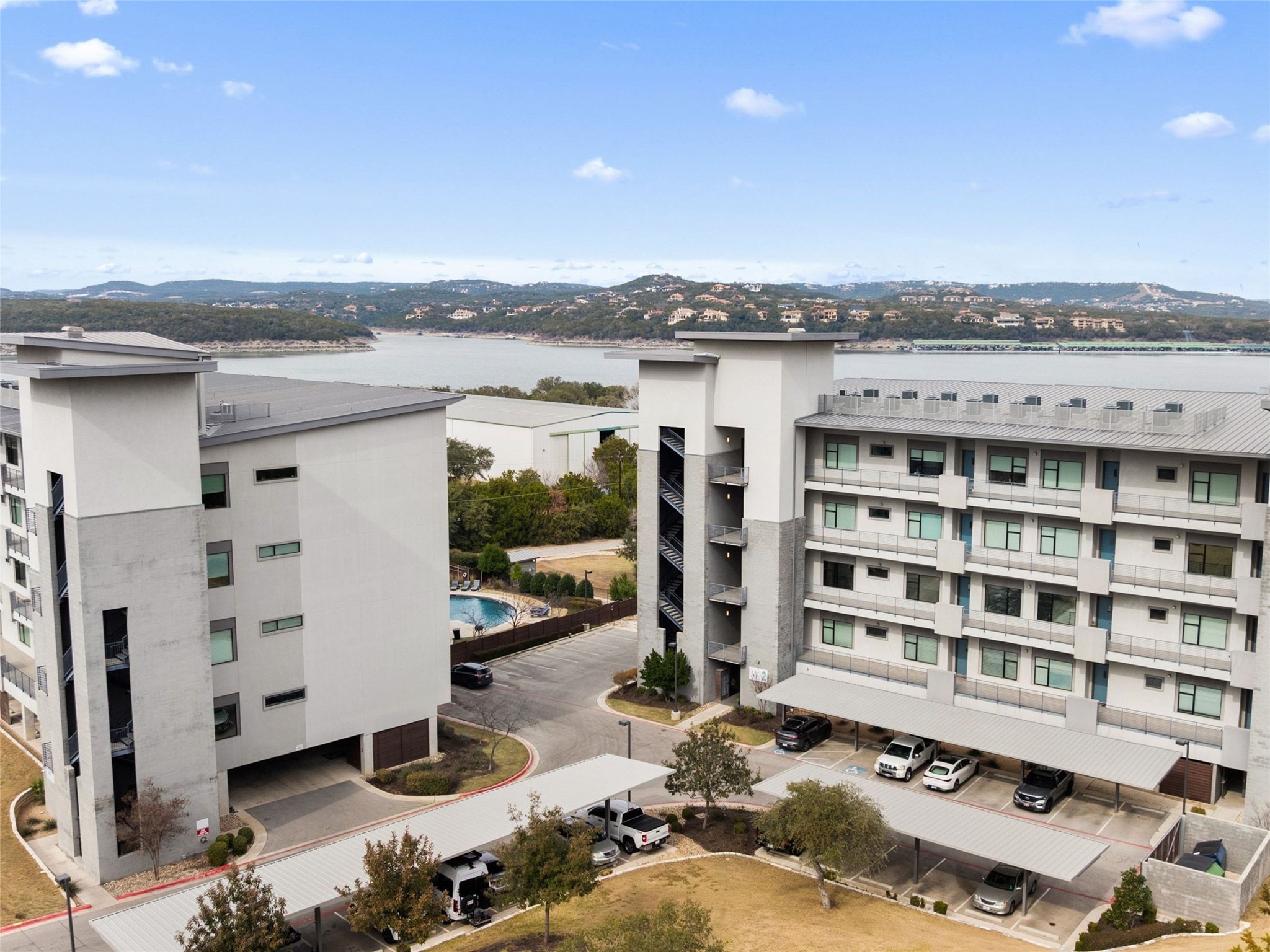 5921 Hiline Road, Unit 1303 Austin, TX 78734 - Photo 33 of 37 a view of a living room with furniture and a floor to ceiling window