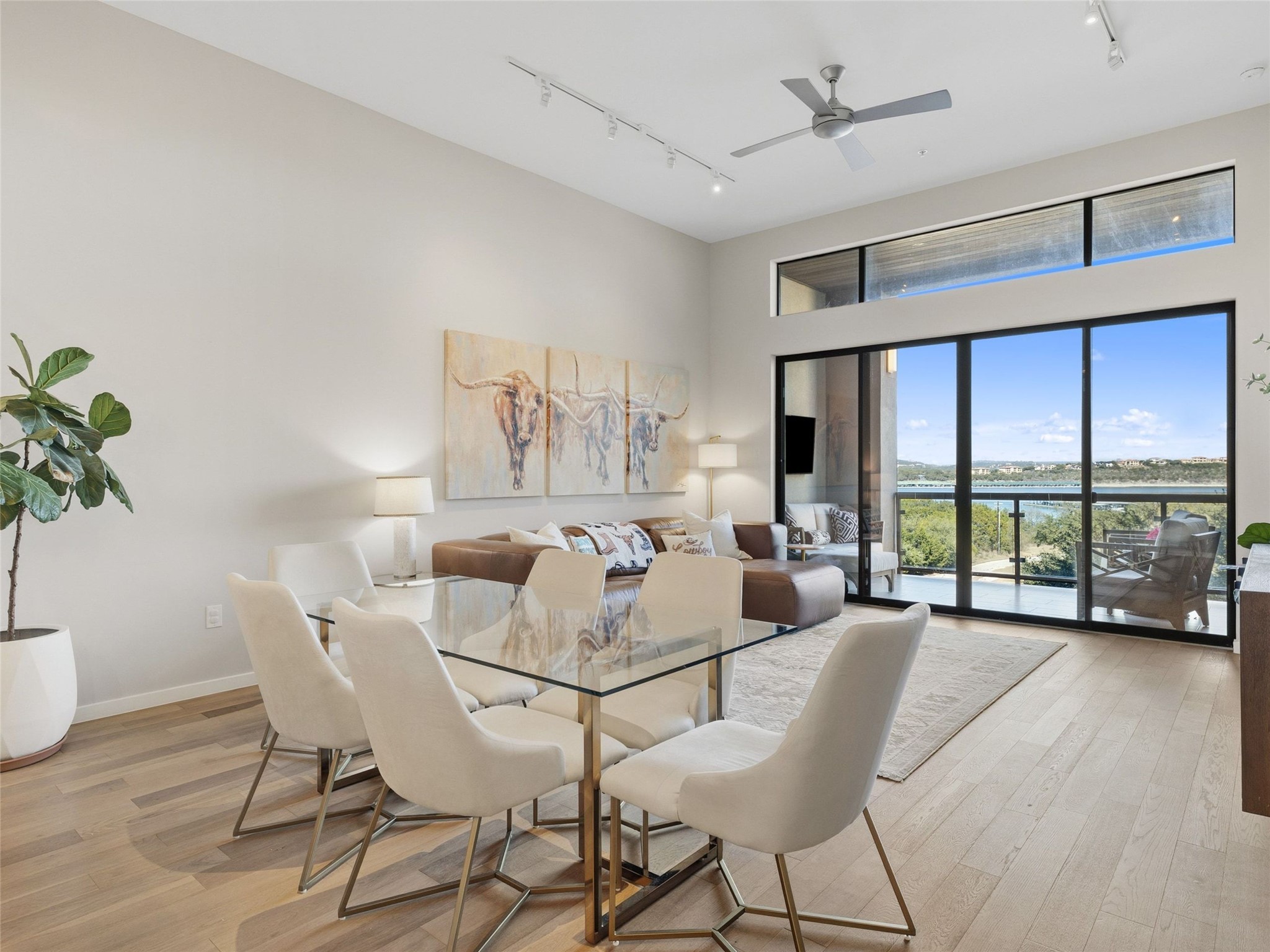 5921 Hiline Road, Unit 1303 Austin, TX 78734 - Photo 7 of 37 a dining room with furniture window and wooden floor