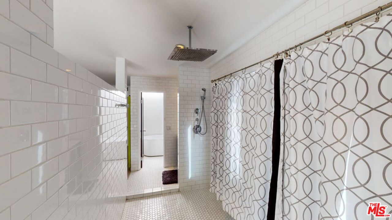 2295 East Nicola Road Palm Springs, CA 92262 - Photo 12 of 23 a bathroom with a shower and a tub