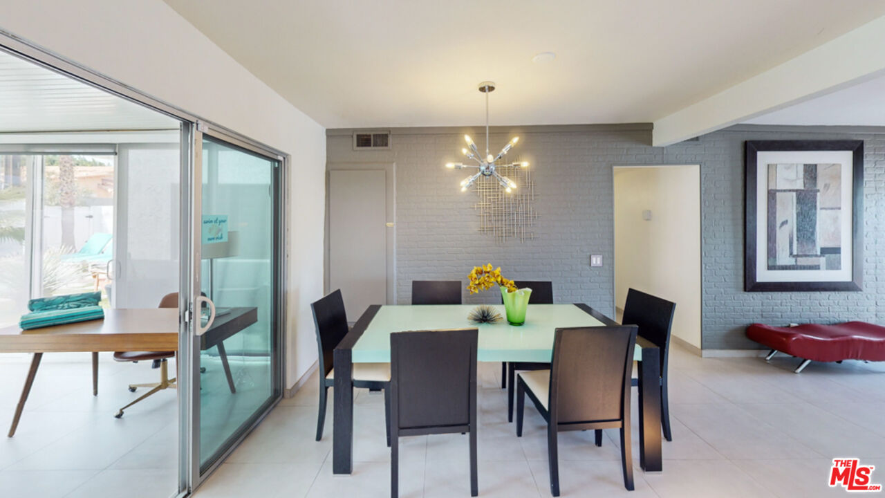 2295 East Nicola Road Palm Springs, CA 92262 - Photo 7 of 23 a view of a dining room with furniture and a livingroom