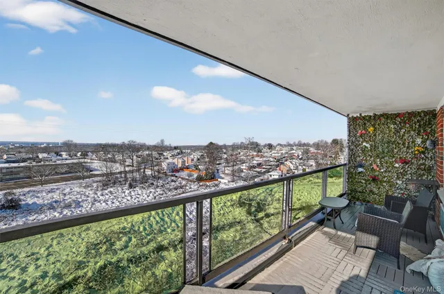 a view of a balcony with furniture