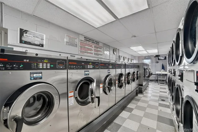 a view of a swimming pool and trees in the background
