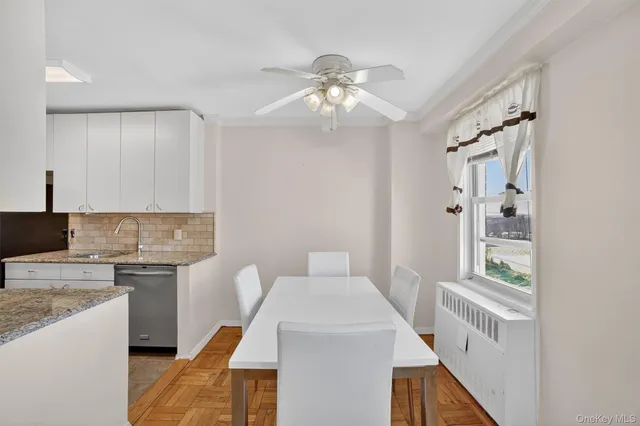 a kitchen with a white cabinets stove and refrigerator