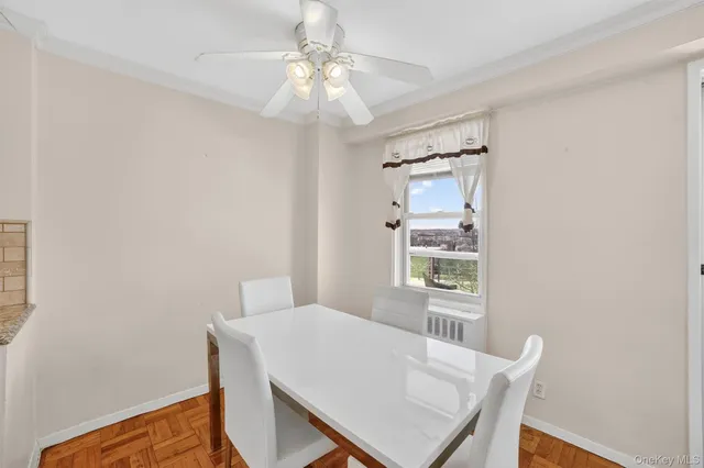 a view of a dining room with furniture and window