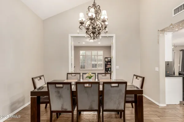 a view of a dining room with furniture and window