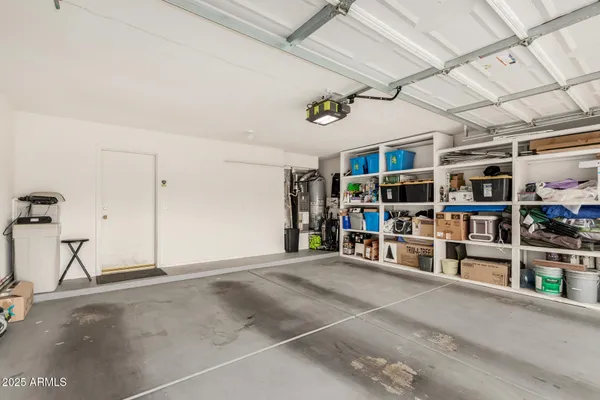 a view of an empty room with lots of shelves