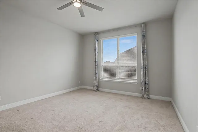 a view of a livingroom with a ceiling fan