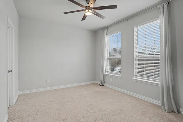 a bathroom with a bathtub shower sink vanity mirror and toilet