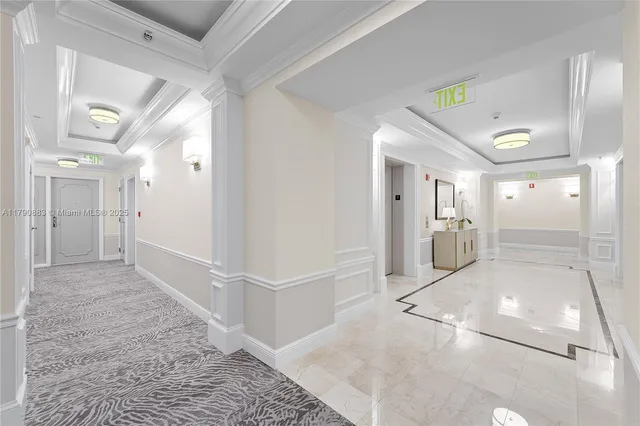 a view of a hallway view with wooden floor and dining room
