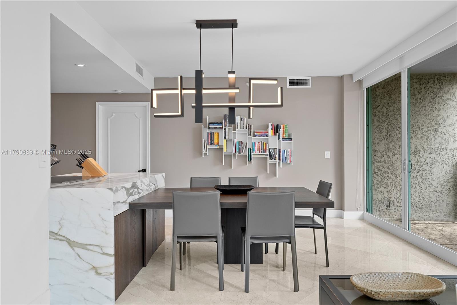 3400 Southwest 27th Avenue, Unit 201 Miami, FL 33133 - Photo 3 of 15 a view of a dining room with furniture