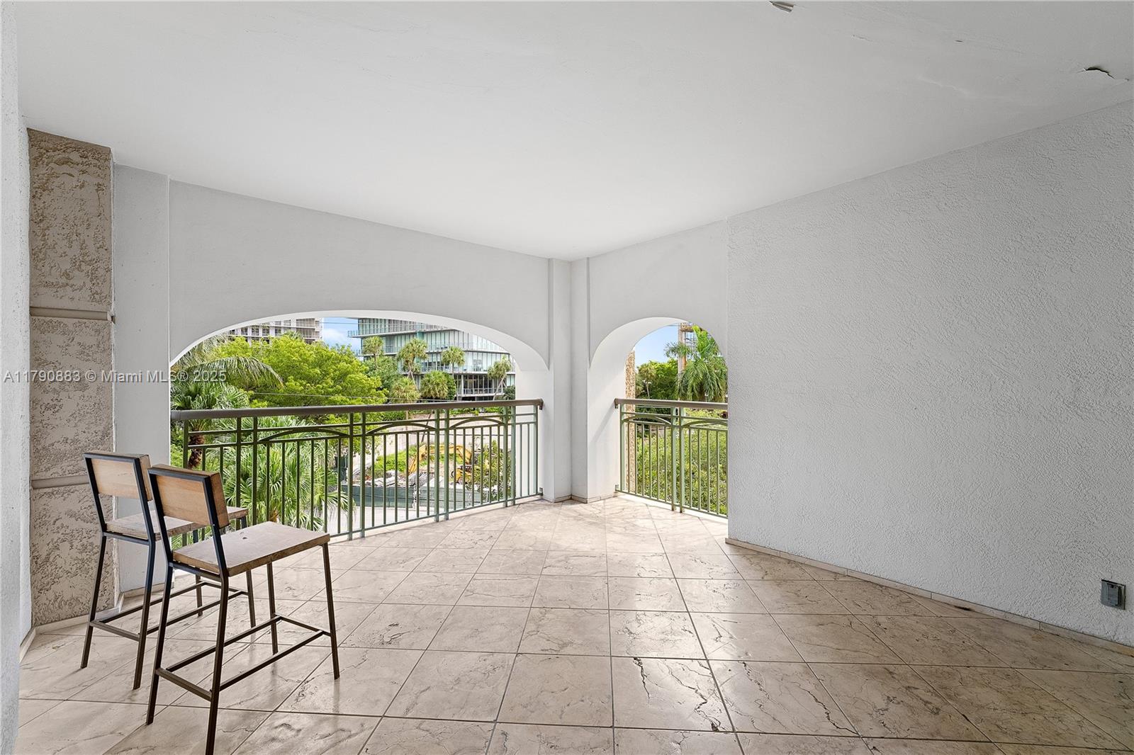 3400 Southwest 27th Avenue, Unit 201 Miami, FL 33133 - Photo 6 of 15 a view of a livingroom with furniture and garden