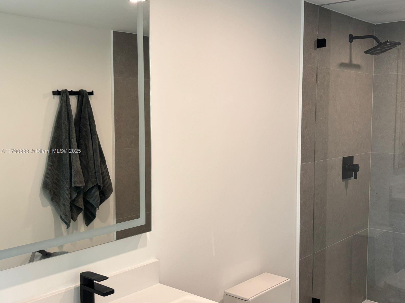 3400 Southwest 27th Avenue, Unit 201 Miami, FL 33133 - Photo 9 of 15 a view of walk in closet