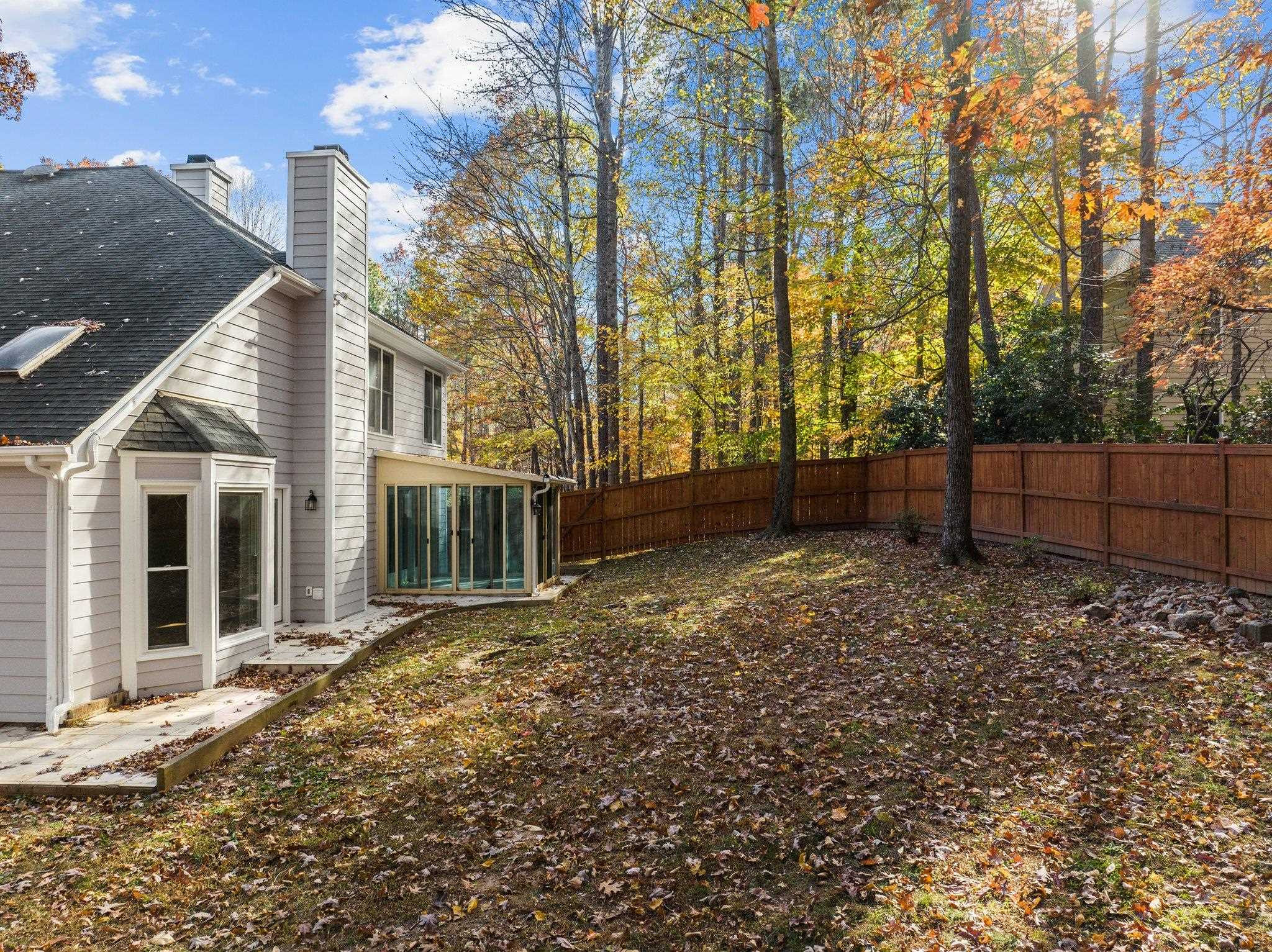 5808 Glenfiddich Way Raleigh, NC 27613 - Photo 11 of 64 a backyard of a house with lots of green space