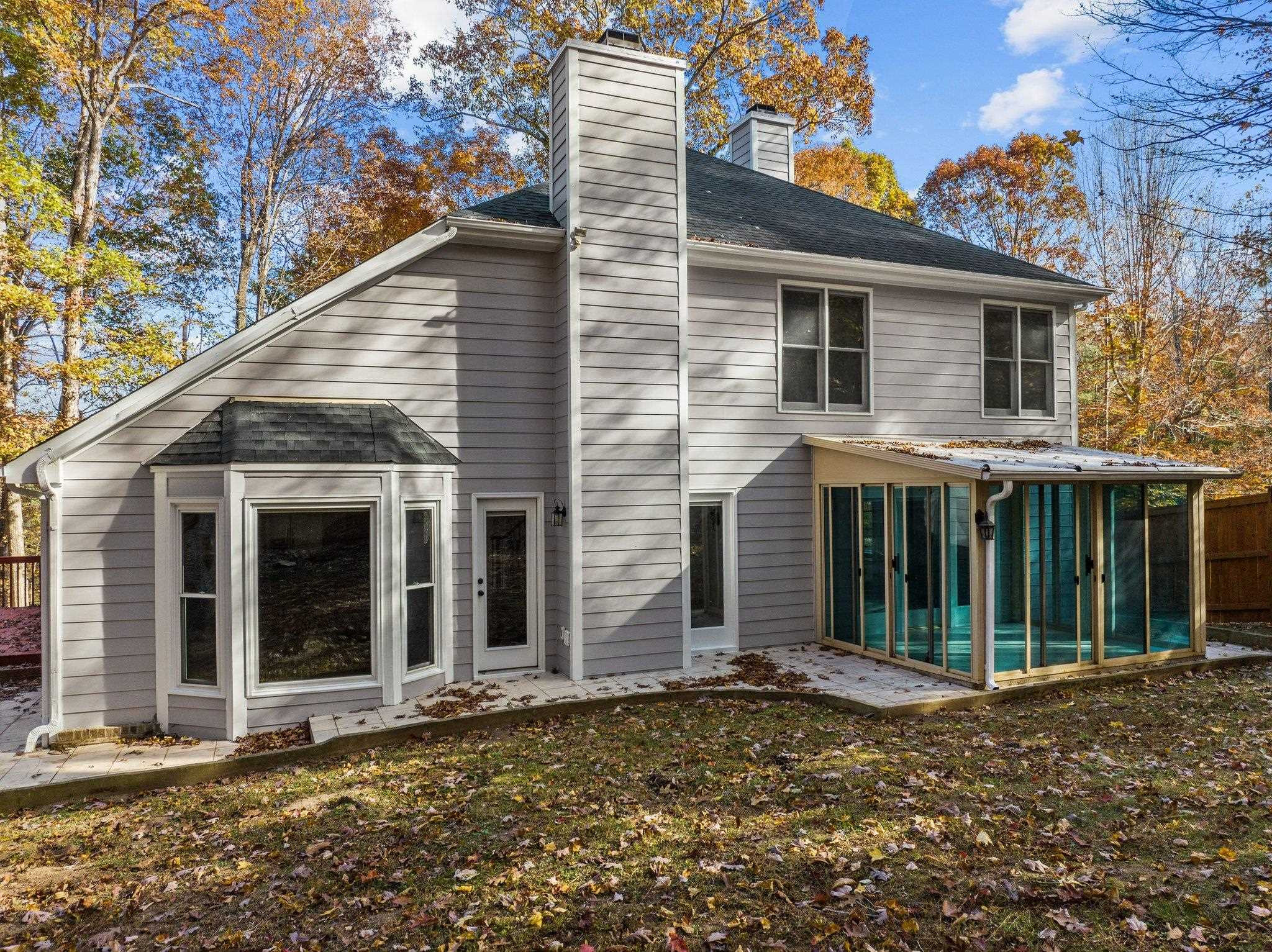 5808 Glenfiddich Way Raleigh, NC 27613 - Photo 12 of 64 a view of a house with a large window and wooden fence