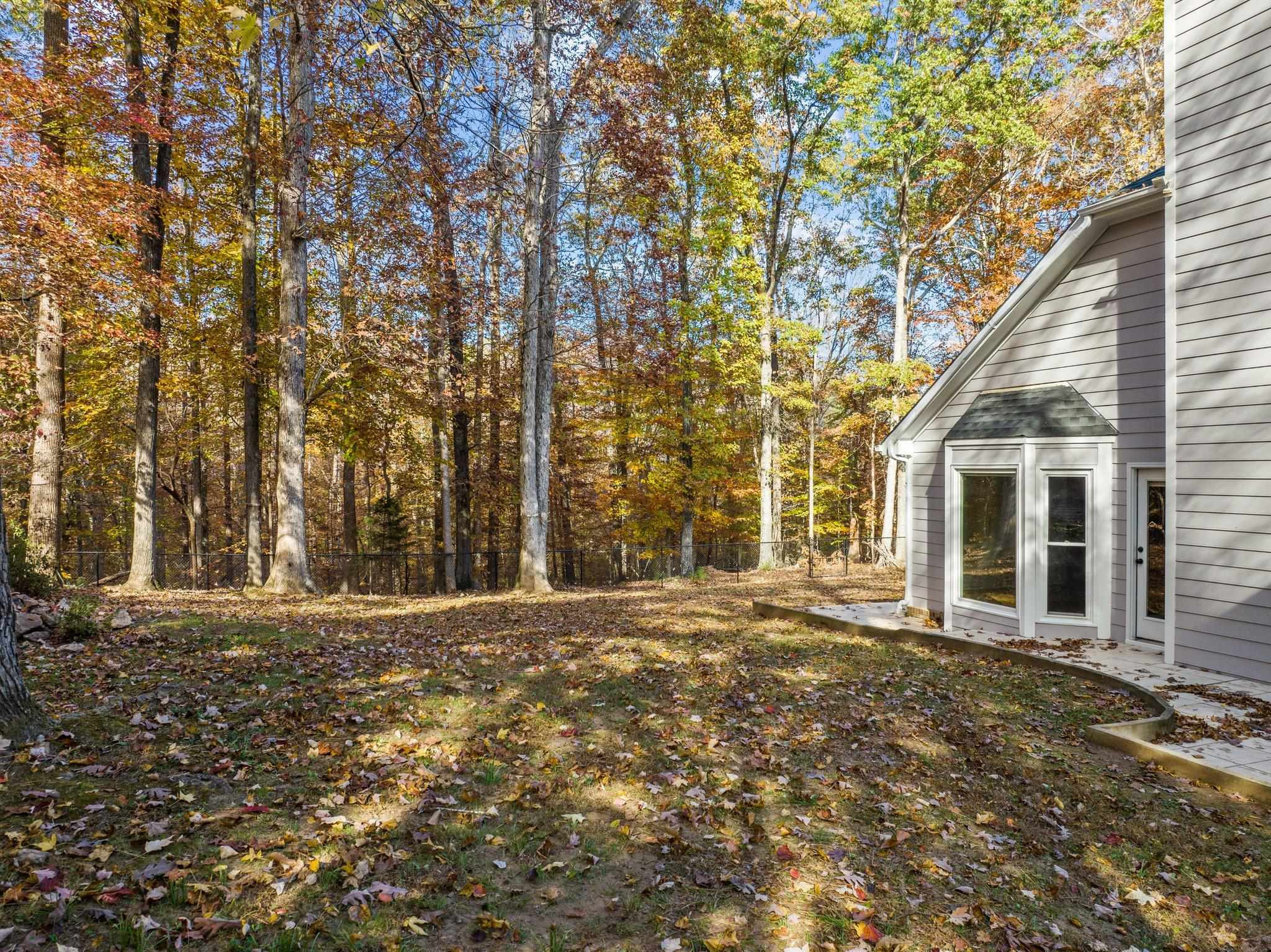5808 Glenfiddich Way Raleigh, NC 27613 - Photo 16 of 64 a front view of a house with a yard