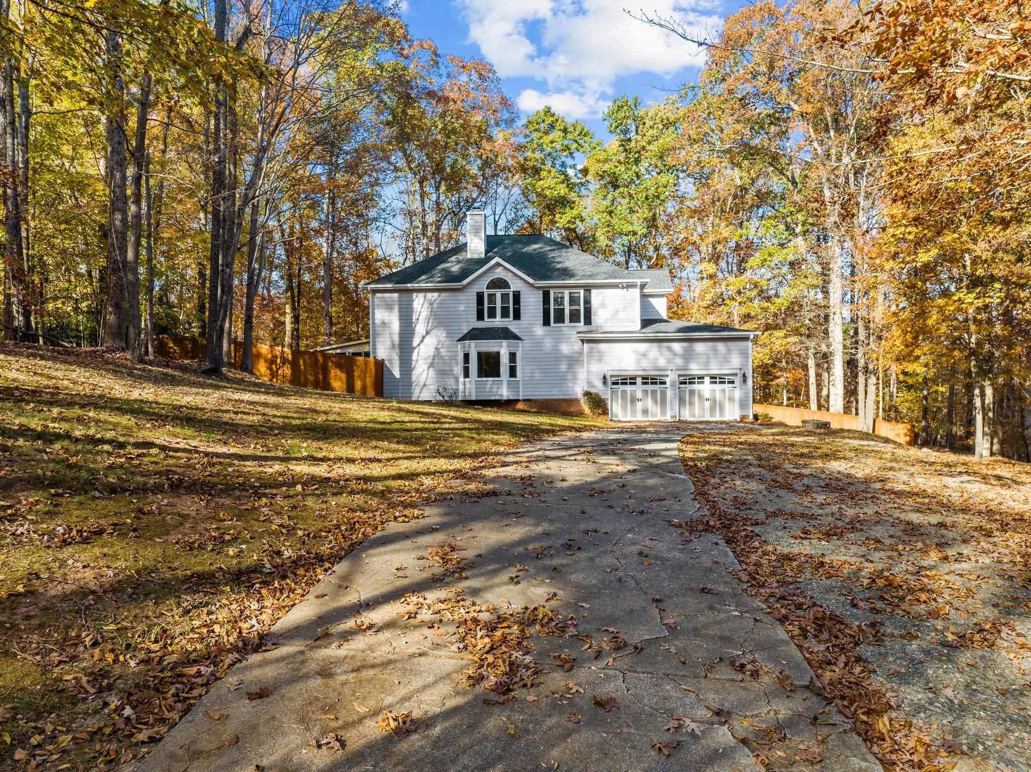 5808 Glenfiddich Way Raleigh, NC 27613 - Photo 2 of 64 a front view of a house with a yard