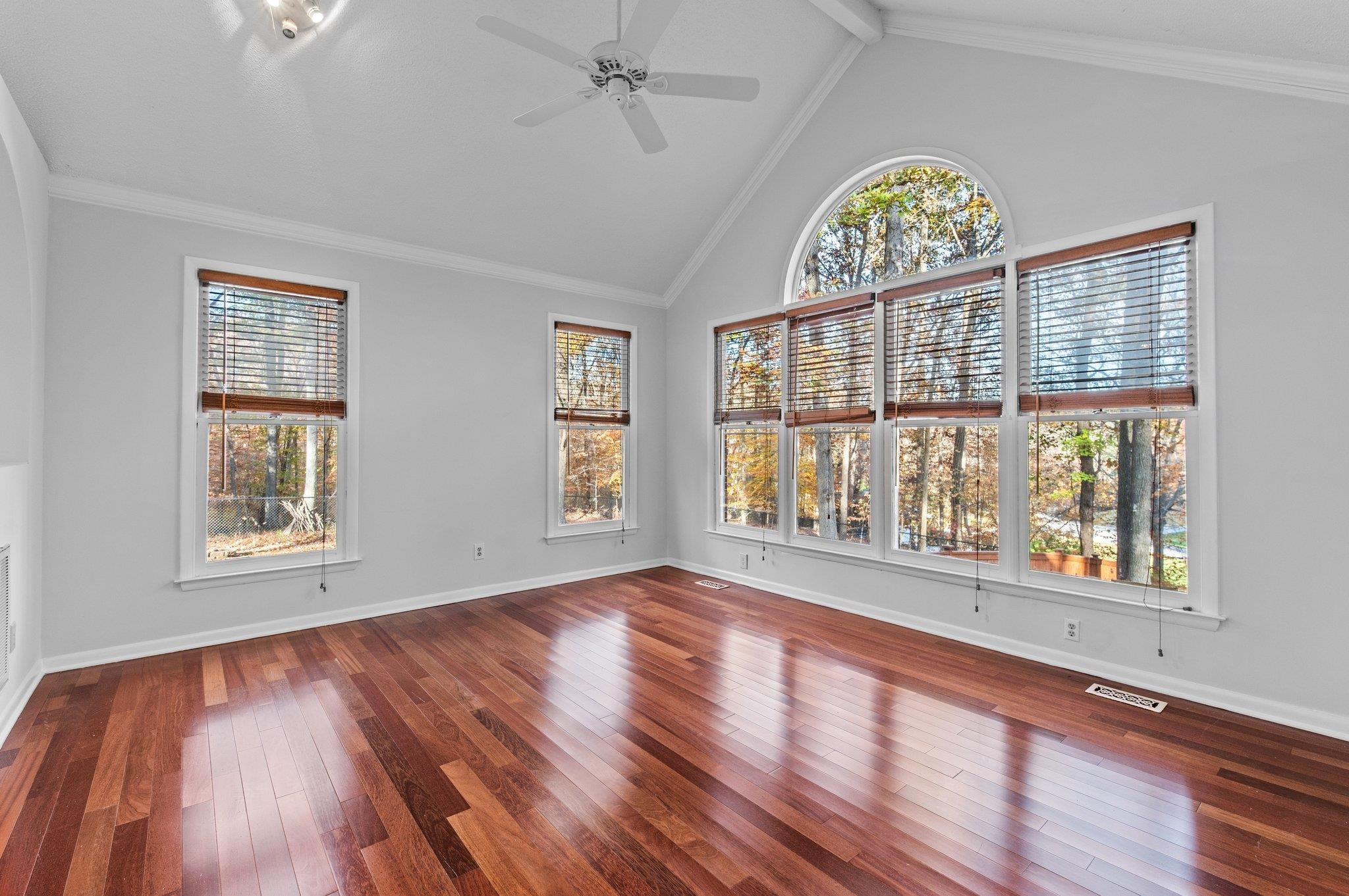5808 Glenfiddich Way Raleigh, NC 27613 - Photo 27 of 64 a view of an empty room with wooden floor and a window