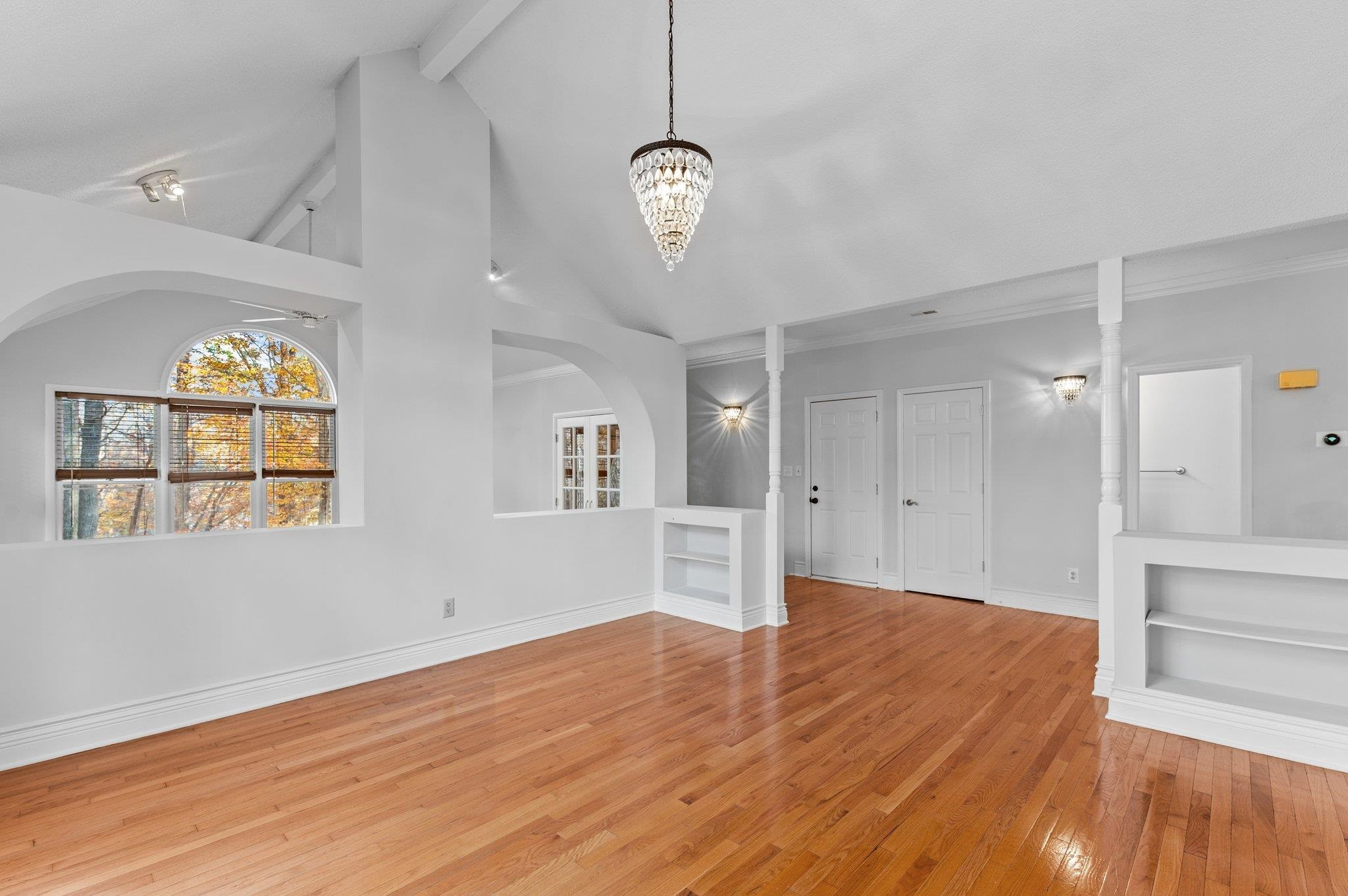 5808 Glenfiddich Way Raleigh, NC 27613 - Photo 30 of 64 a view of a room with wooden floor chandelier and windows
