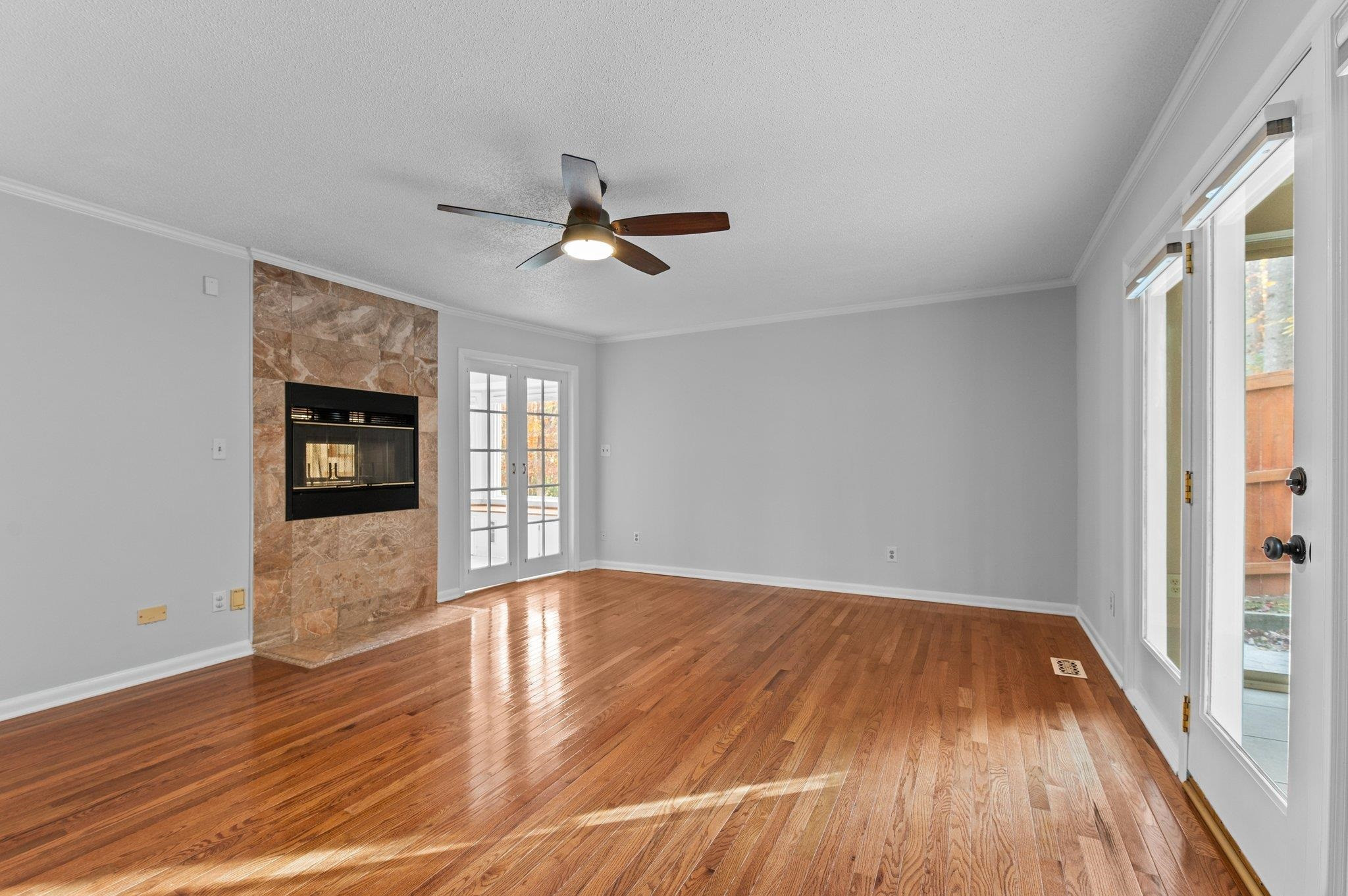 5808 Glenfiddich Way Raleigh, NC 27613 - Photo 47 of 64 a view of empty room with wooden floor and fan